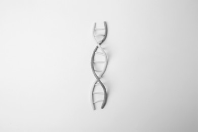 Photo of DNA molecule model madecolorful plasticine on white background, top view