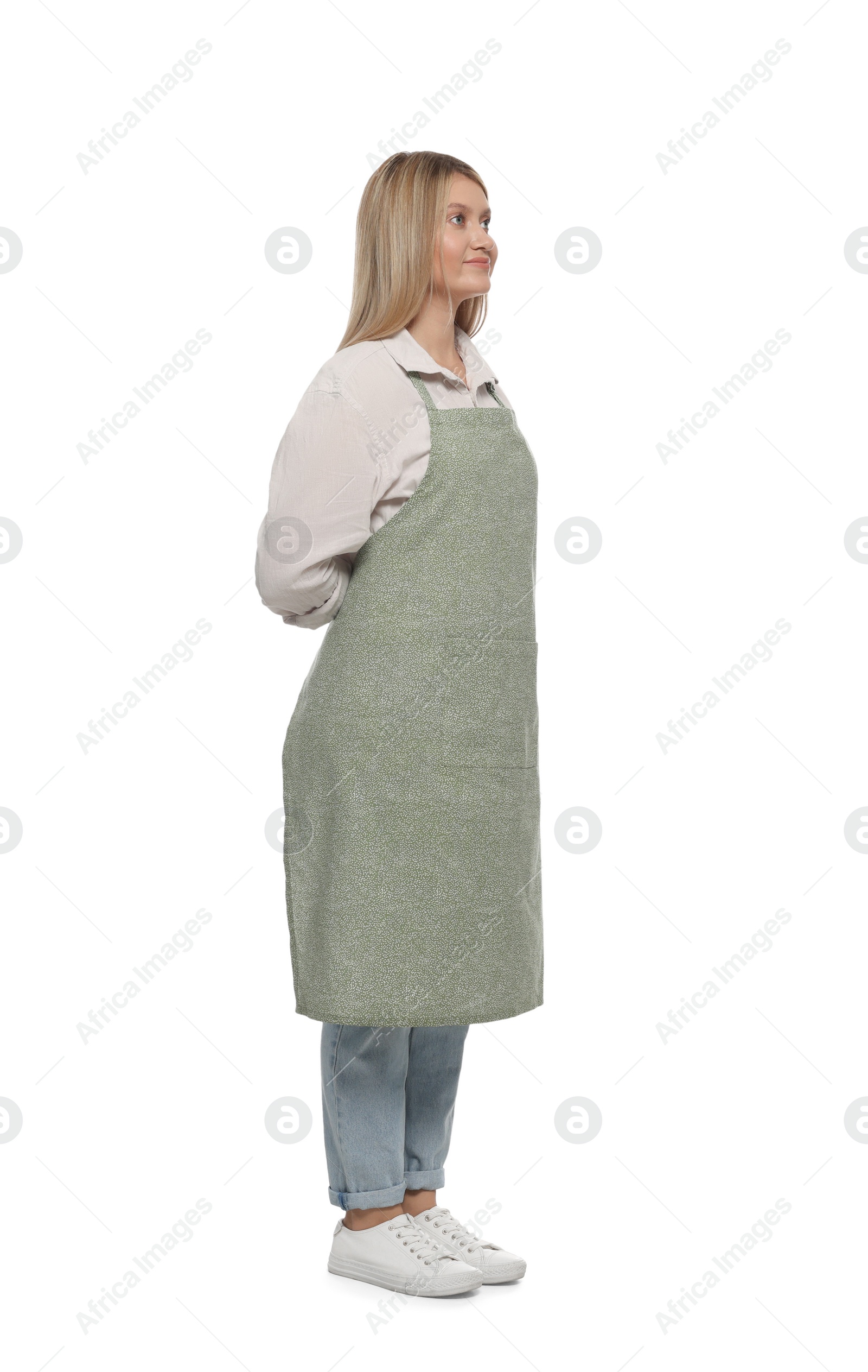 Photo of Beautiful young woman in clean apron on white background