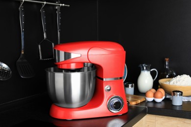 Photo of Modern stand mixer on countertop in kitchen