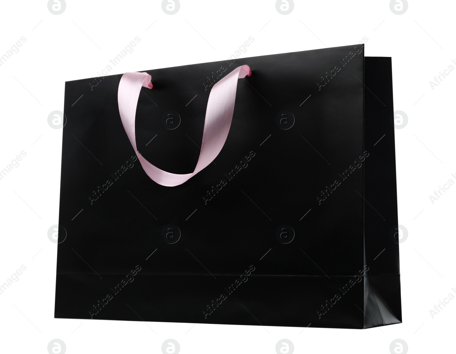 Photo of Paper shopping bag with ribbon handles on white background. Mockup for design