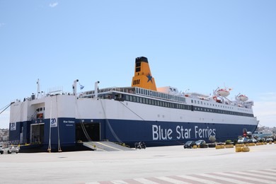 PIRAEUS, GREECE - MAY 19, 2022: Picturesque view of port with Blue Star ferry on sunny day