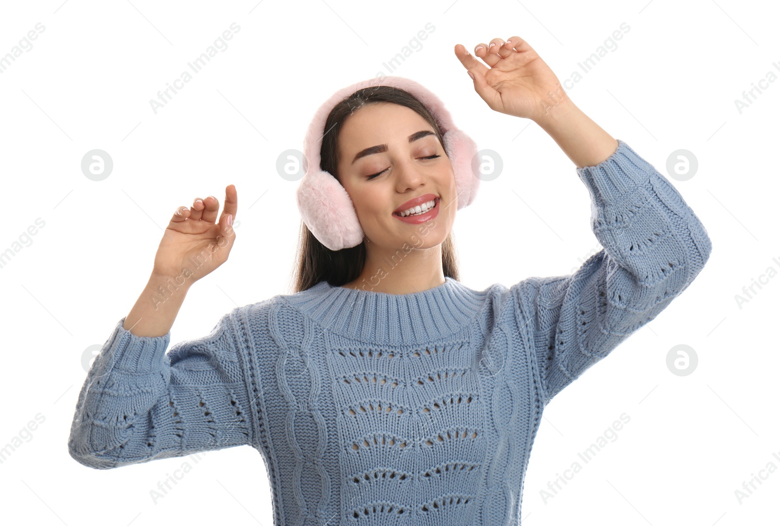 Photo of Beautiful young woman wearing earmuffs on white background