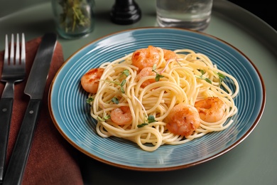 Delicious pasta with shrimps on plate