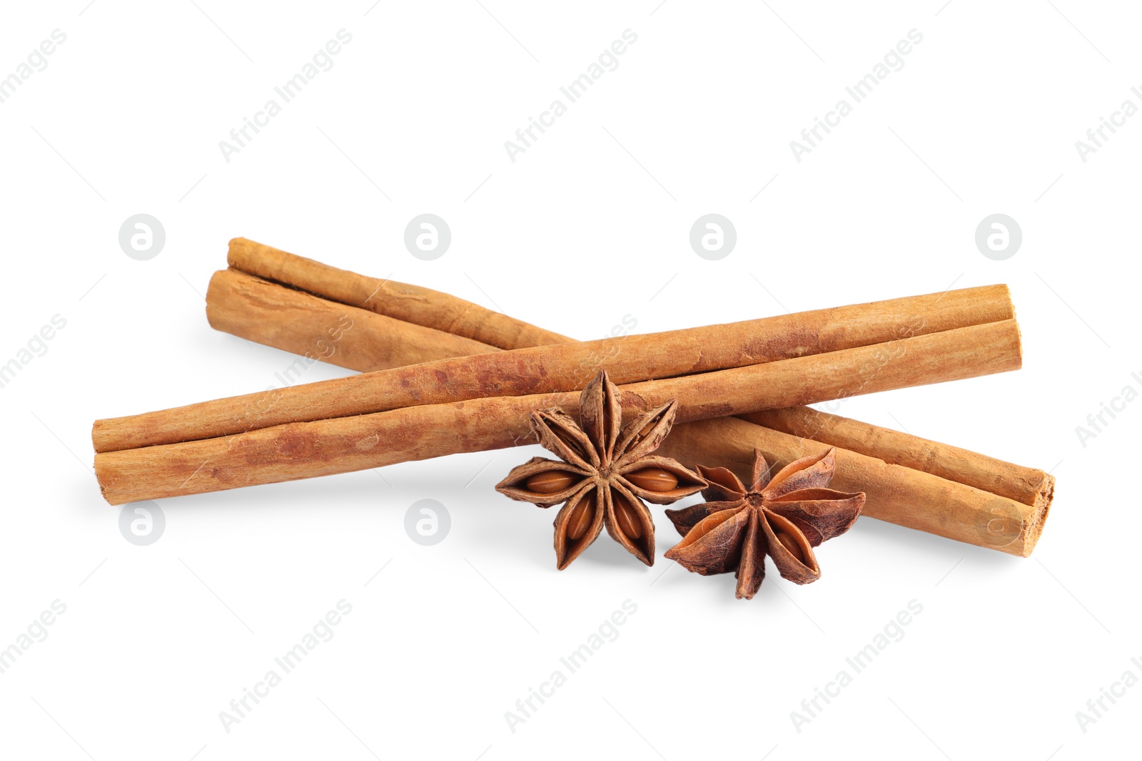 Photo of Cinnamon sticks and anise stars isolated on white