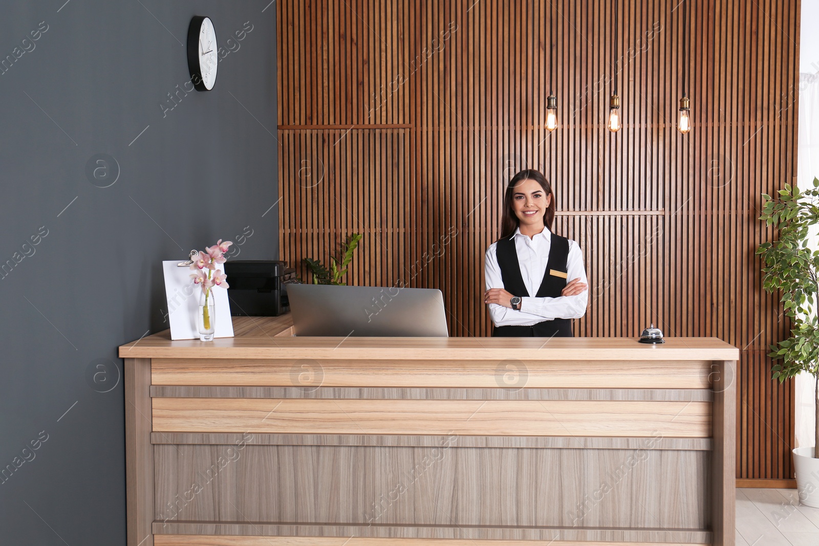 Photo of Portrait of receptionist at desk in lobby