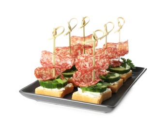 Tasty canapes with salami, cucumber and cream cheese isolated on white