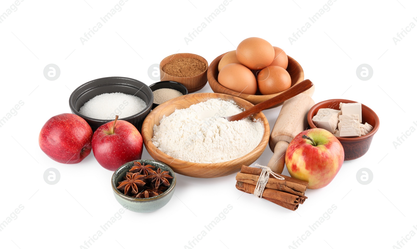 Photo of Yeast cake, flour and different ingredients on white background. Making pie