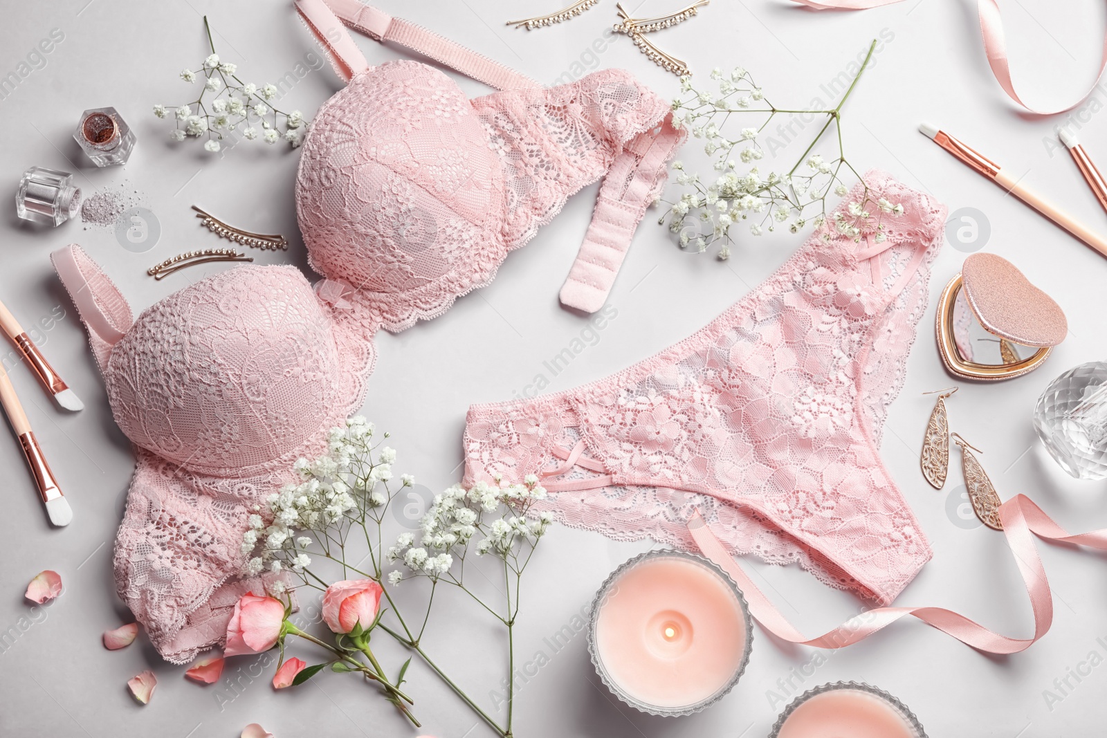 Photo of Composition with elegant women's underwear on light background, flat lay