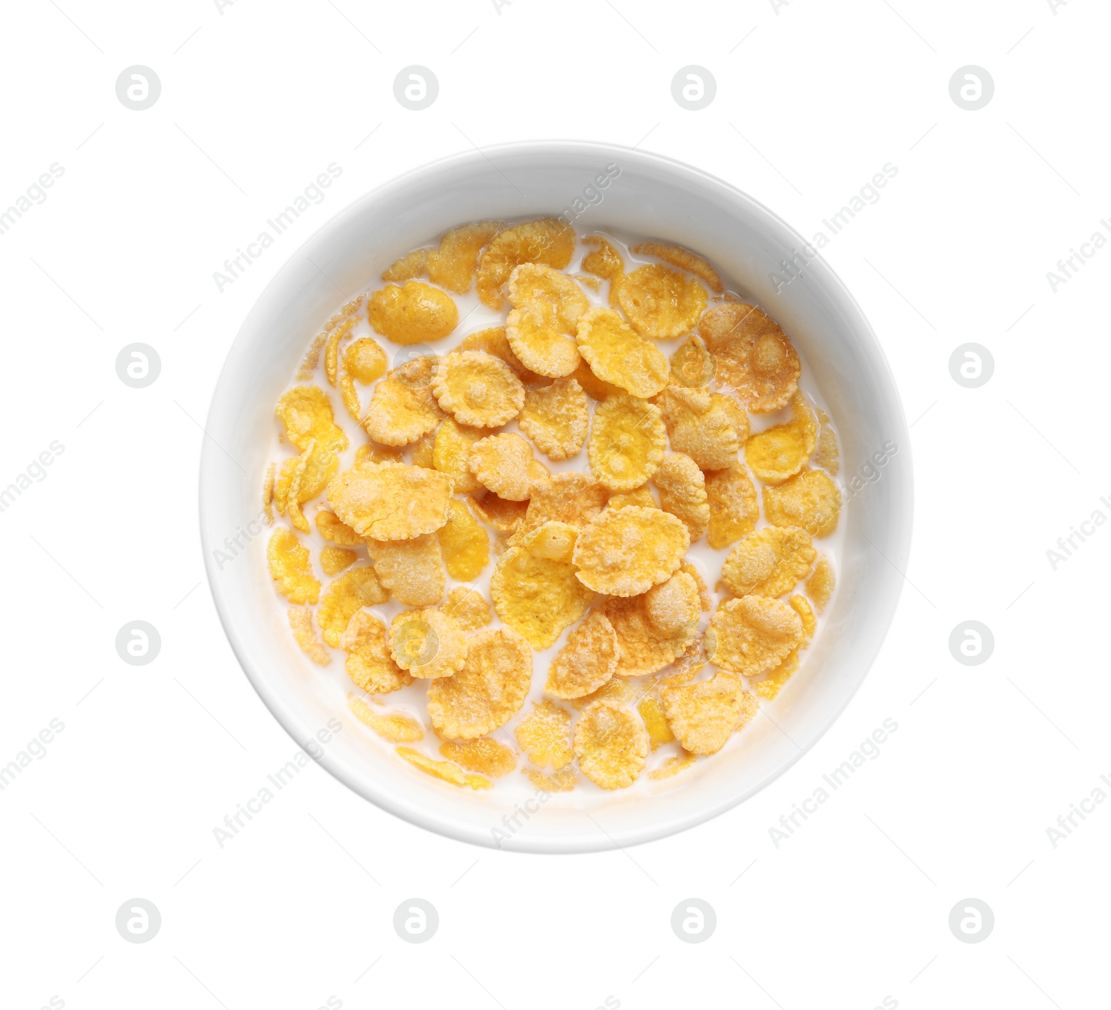 Photo of Tasty corn flakes with milk in bowl isolated on white, top view