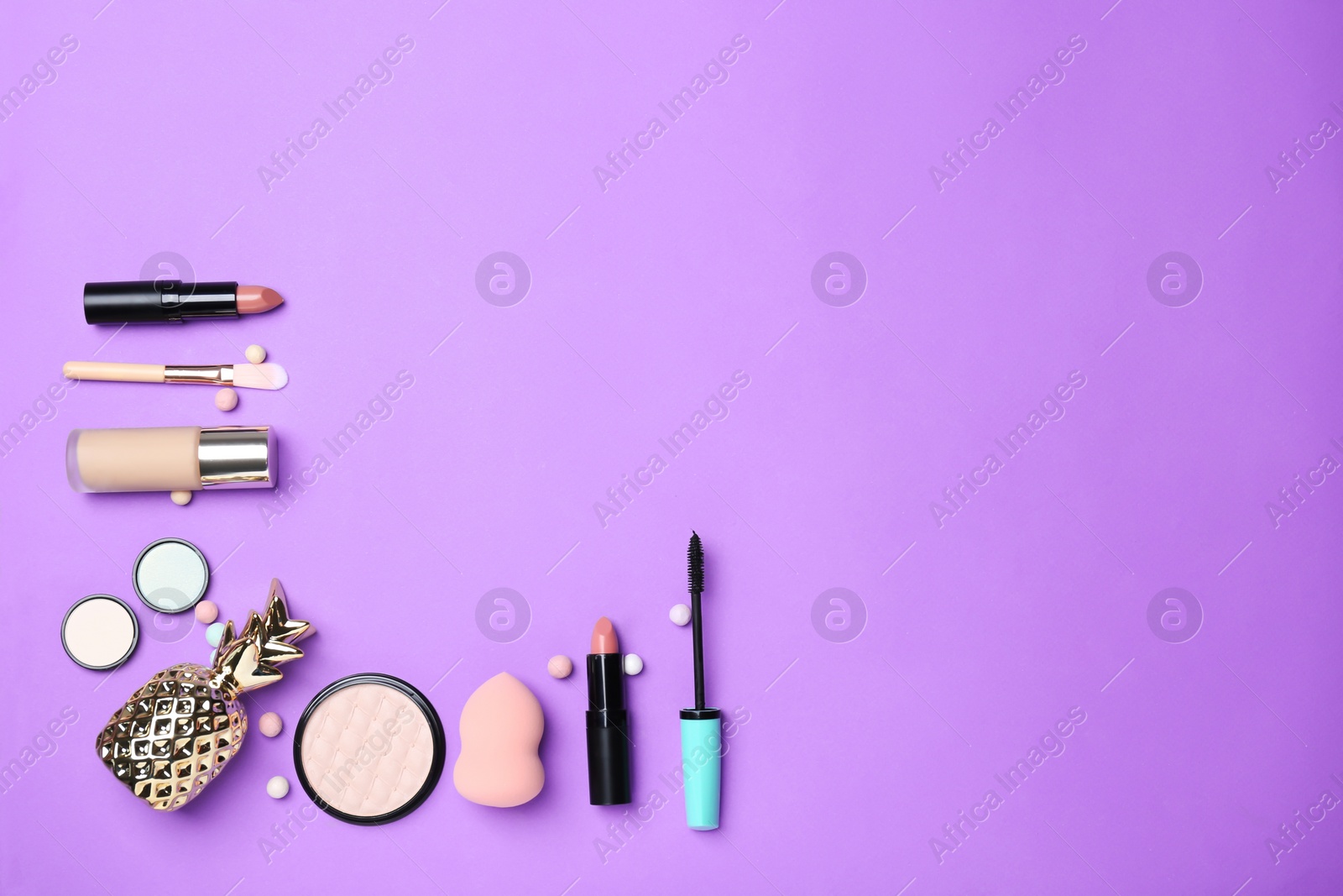 Photo of Decorative makeup products on color background