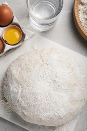 Photo of Flat lay composition with dough and ingredients on light grey marble table. Sodawater bread recipe