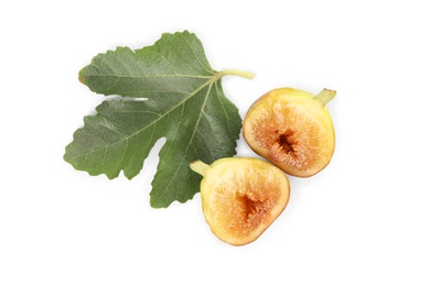 Photo of Halves of tasty fig with leaf isolated on white, top view