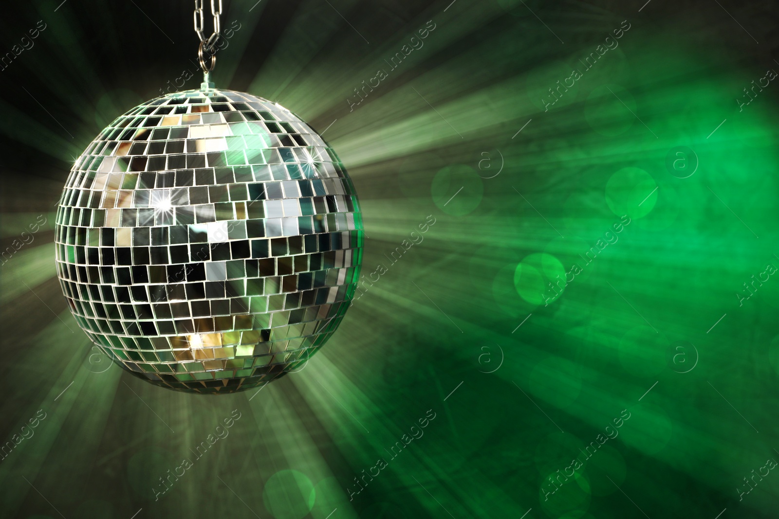 Image of Shiny disco ball on dark background. Space for text