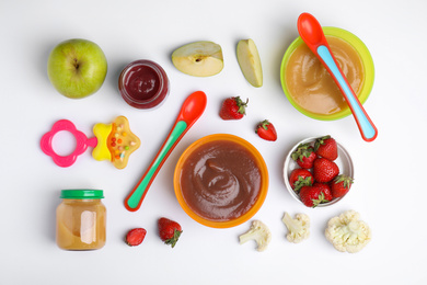 Photo of Flat lay composition with baby food and ingredients on white background