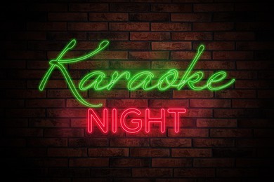 Illustration of Glowing neon sign with words Karaoke Night on brick wall