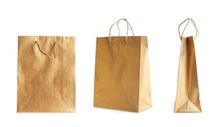 Image of Set of paper shopping bags on white background