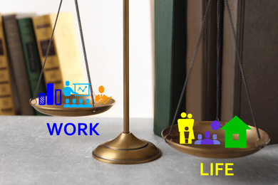 Work-life balance concept. Scale with images on table, closeup