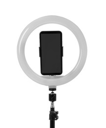 Tripod with ring light and smartphone isolated on white