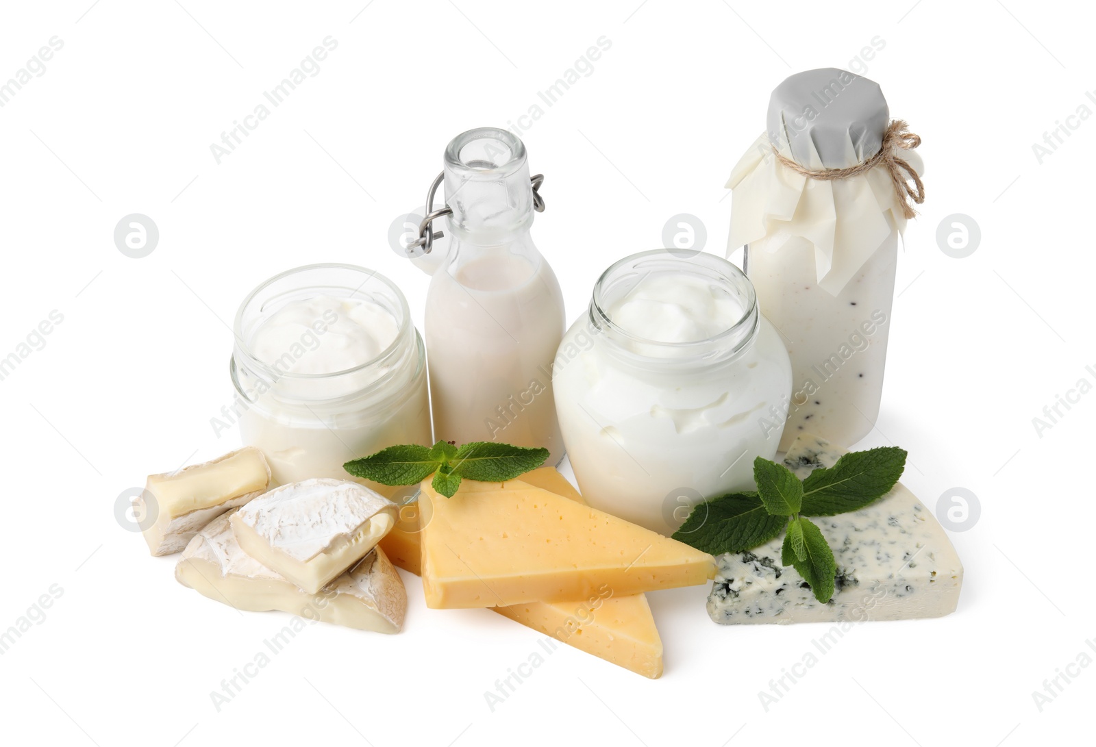 Photo of Different dairy products and mint isolated on white