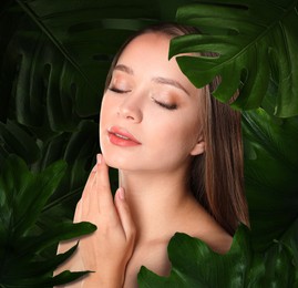 Image of Beautiful young woman feeling harmony while enjoying nature. Girl surrounded by green leaves