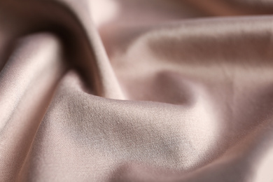 Photo of Texture of delicate pink fabric as background, closeup