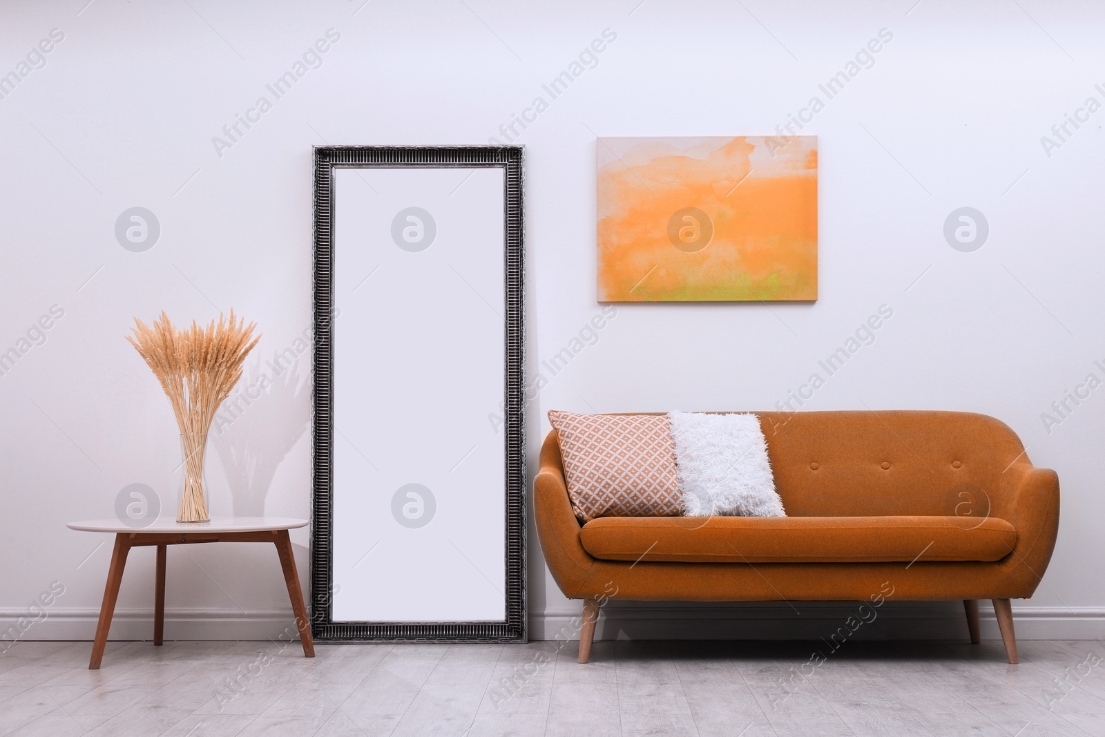 Image of Modern orange painting and stylish furniture in living room interior