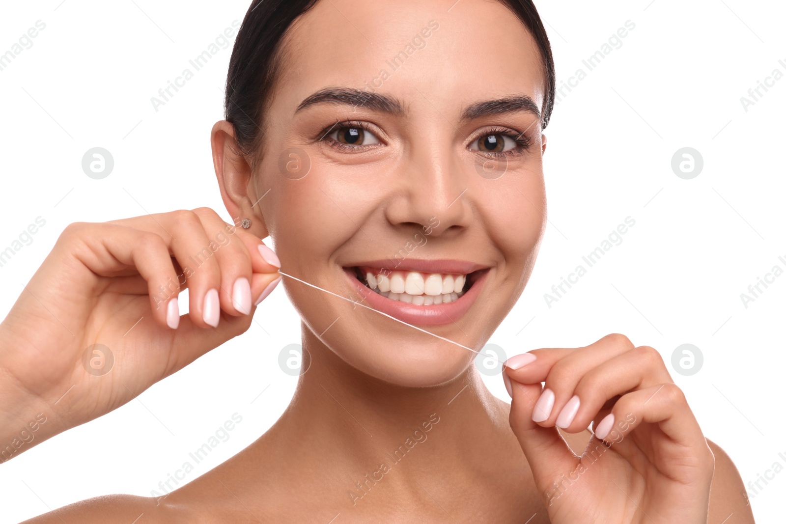 Photo of Young woman flossing her teeth on white background. Cosmetic dentistry