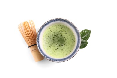 Photo of Cup of matcha tea and bamboo whisk isolated on white, top view