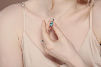 Young woman with elegant jewelry, closeup view