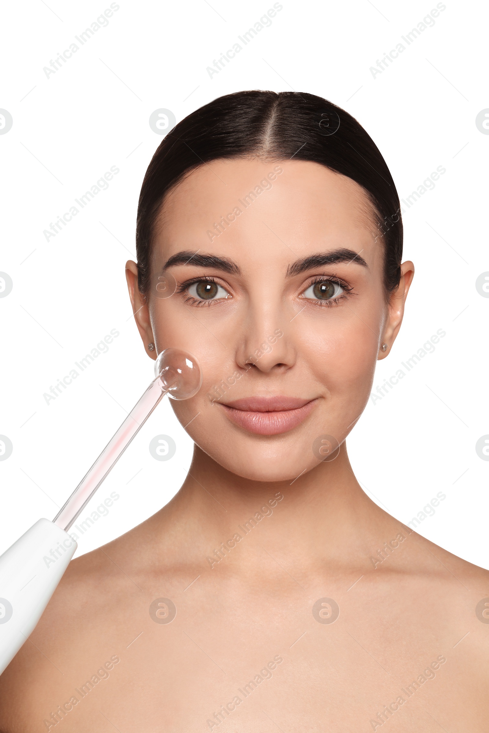 Photo of Woman using high frequency darsonval device on white background