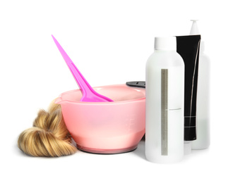 Photo of Professional tools for hair dyeing on white background