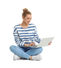 Beautiful young woman using laptop on white background