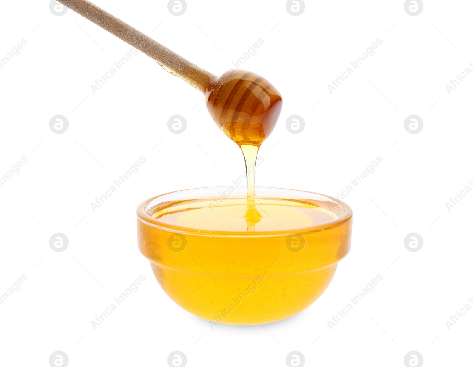 Photo of Honey dripping from dipper into bowl on white background