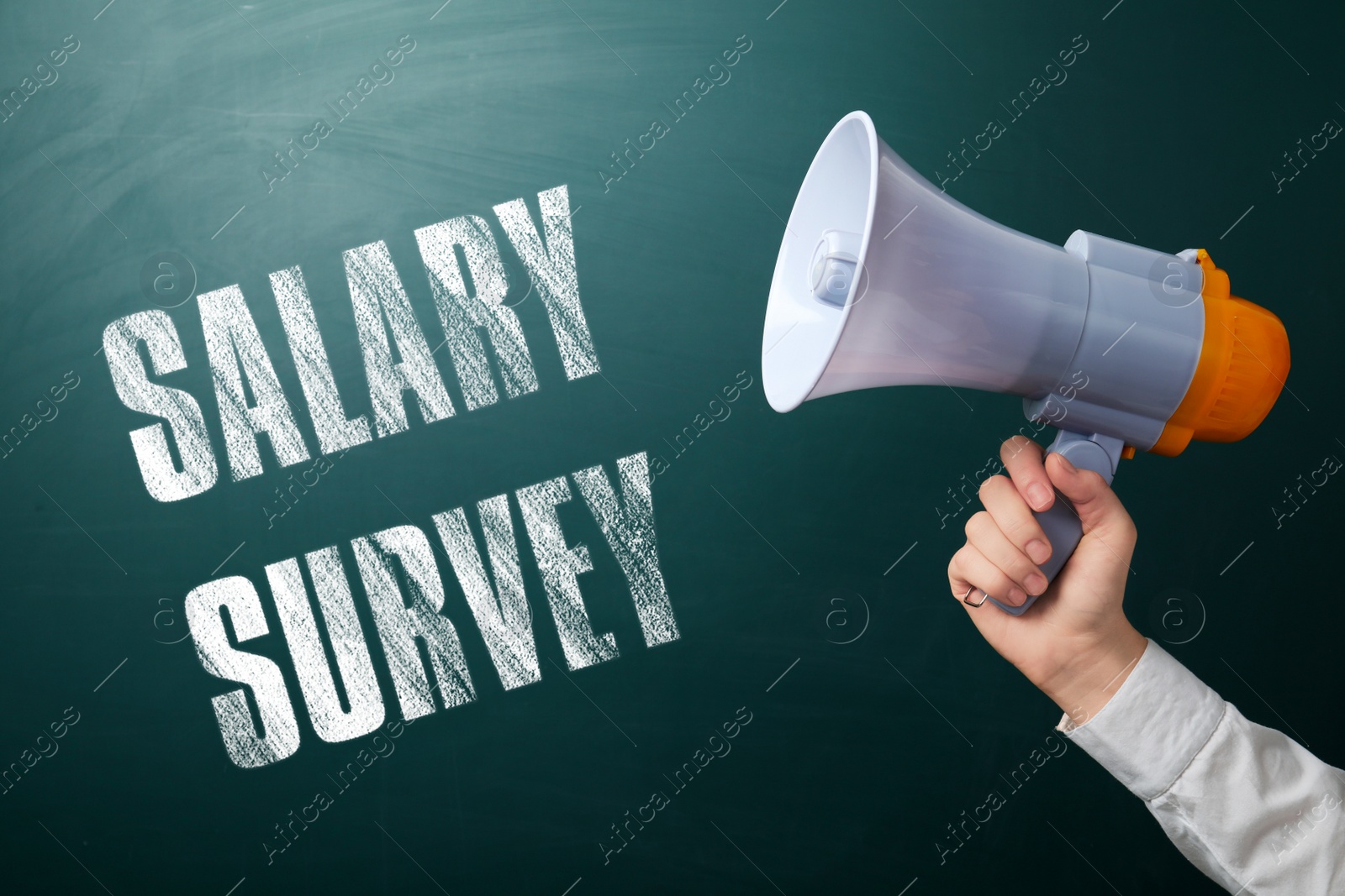 Image of Man with megaphone and phrase Salary Survey on green chalkboard, closeup