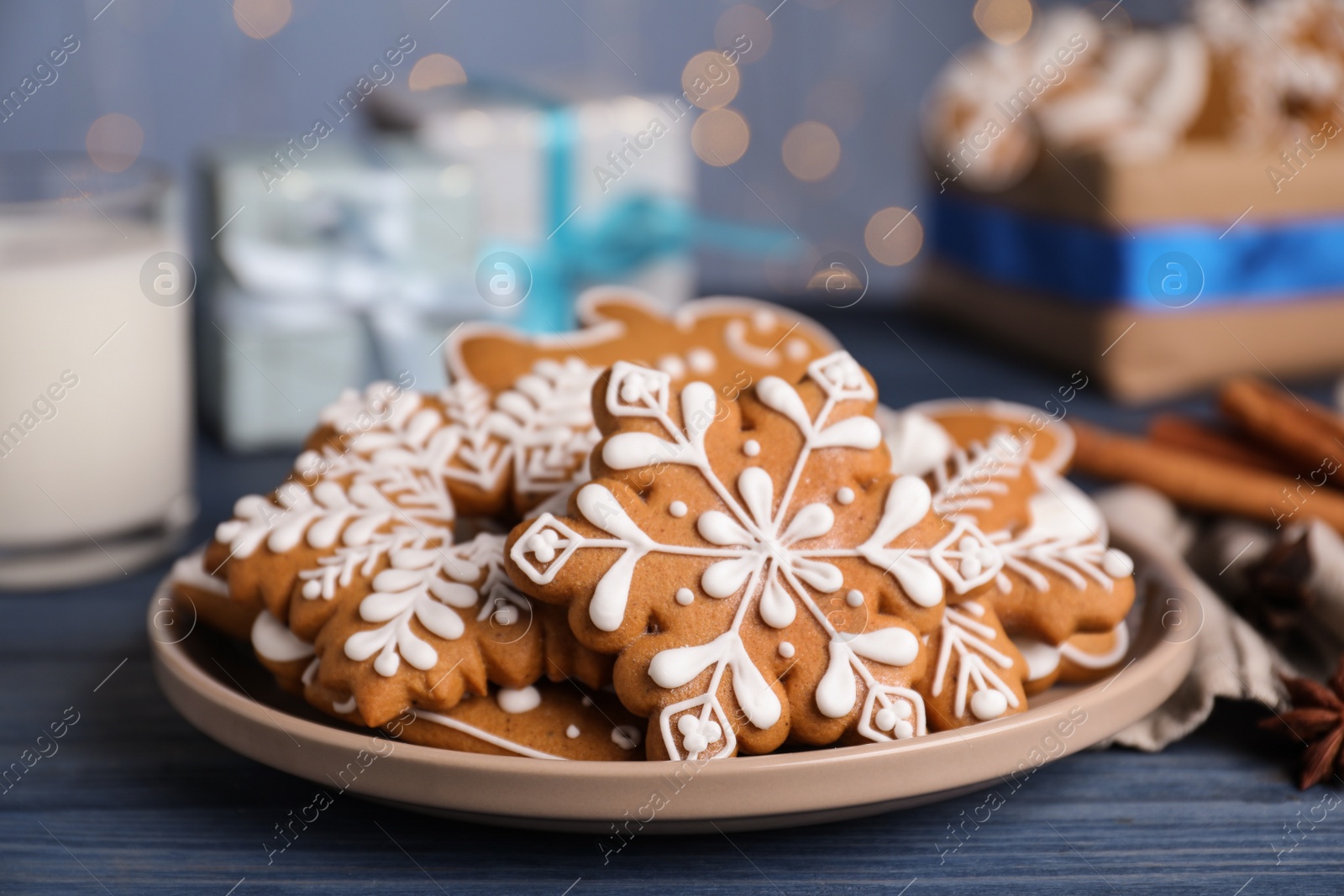 Photo of Delicious Christmas cookies on blue wooden table