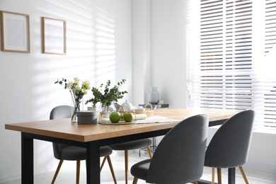 Stylish room interior with table and chairs. Idea for design