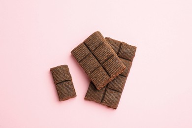 Photo of Delicious and healthy hematogen on pink background, flat lay