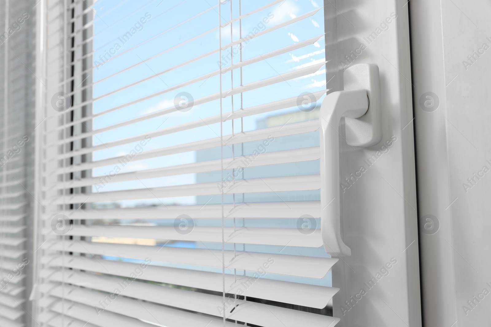 Photo of Window with horizontal blinds indoors, closeup view