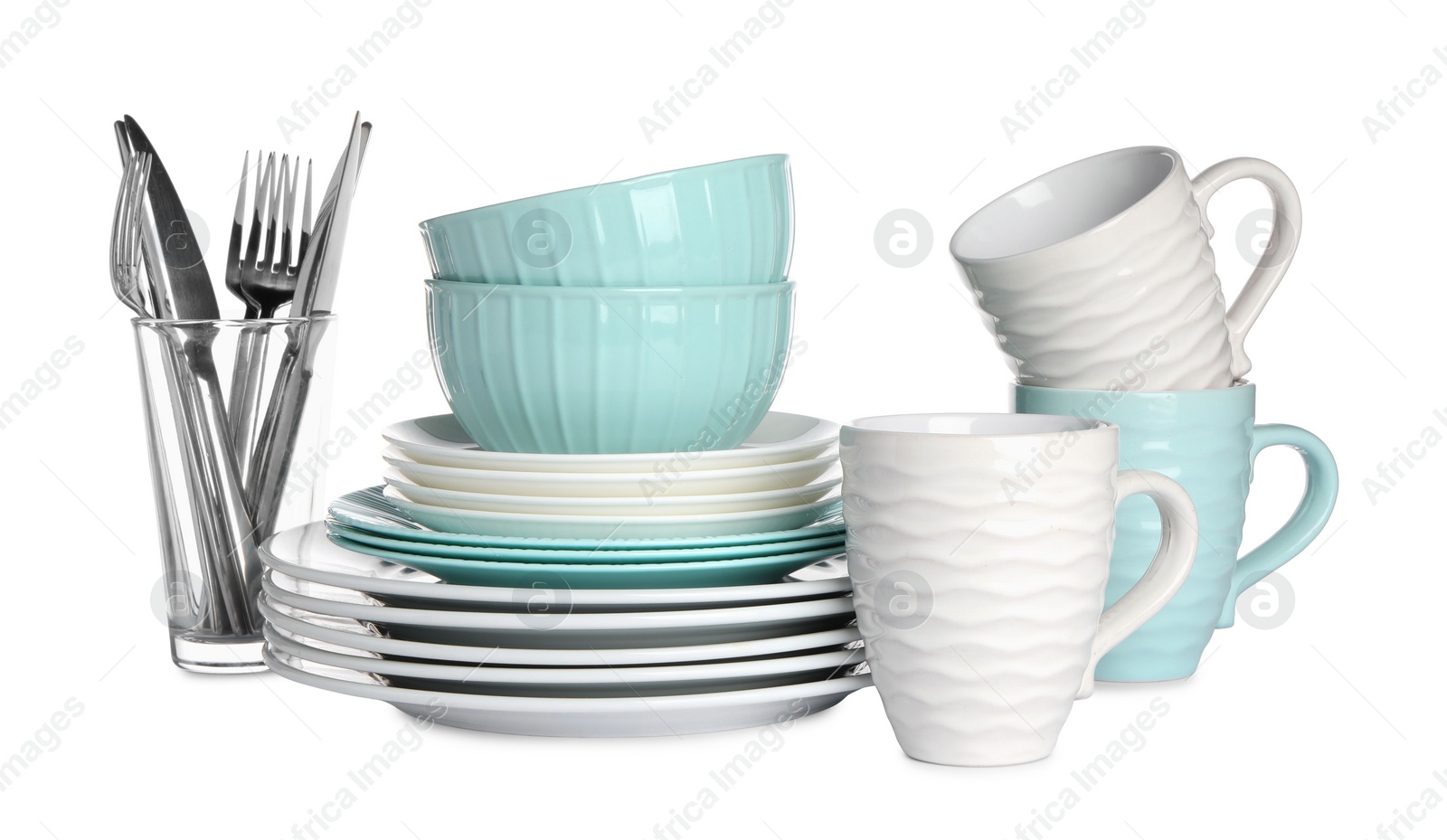 Photo of Set of beautiful ceramic dishware, glass and cutlery isolated on white