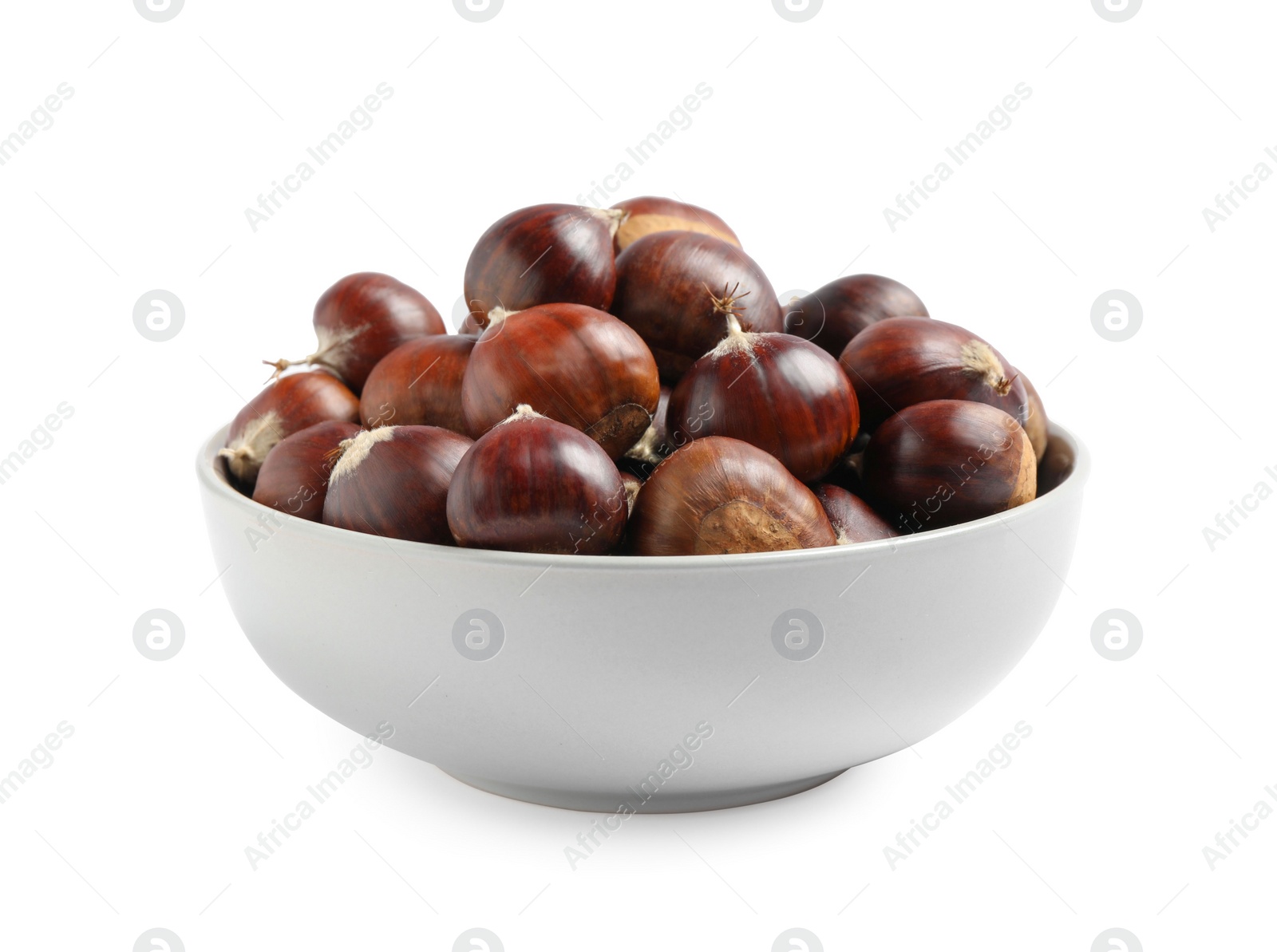 Photo of Fresh sweet edible chestnuts in bowl on white background