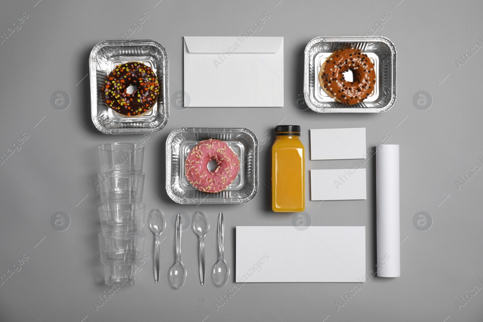 Photo of Flat lay composition with items for mock up design on gray background. Food delivery service