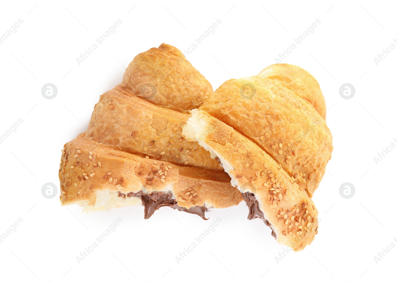 Photo of Halves of tasty croissant with chocolate and sesame seeds on white background, top view