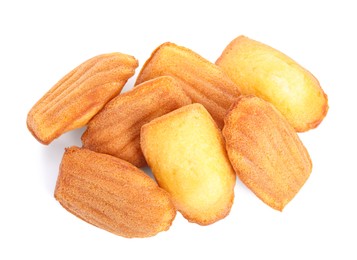 Pile of delicious madeleine cakes on white background, top view