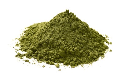 Photo of Heap of henna powder isolated on white