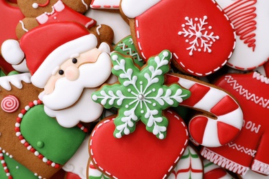 Photo of Different Christmas gingerbread cookies as background, top view