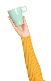 Photo of Woman holding elegant green cup on white background, closeup