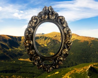 Vintage frame and beautiful mountains under blue sky with clouds