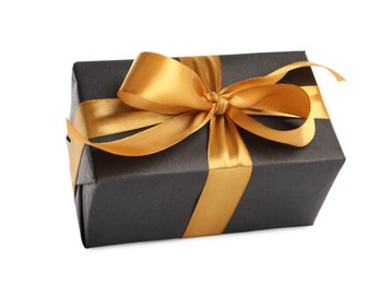 Photo of Beautiful gift box with golden ribbon and bow on white background