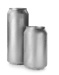 Aluminum cans of beverage covered with water drops on white background. Space for design