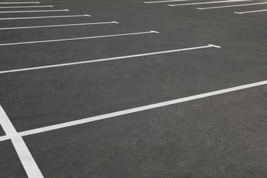 Car parking lot with white marking outdoors